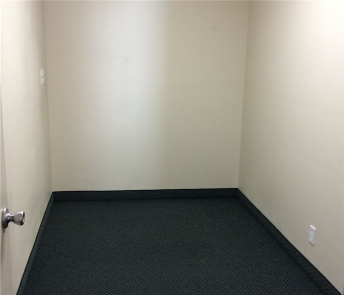 Commercial closet dried and restored with new carpet