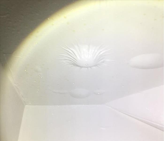 Ceiling paint bubbling in a home